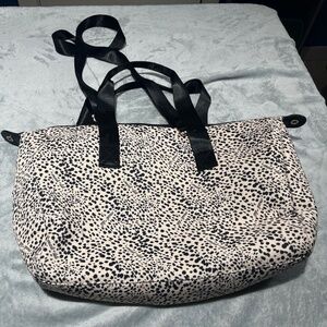 Mali  + Lili signature cheetah Weekender Bag.